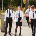 students outside school buildings